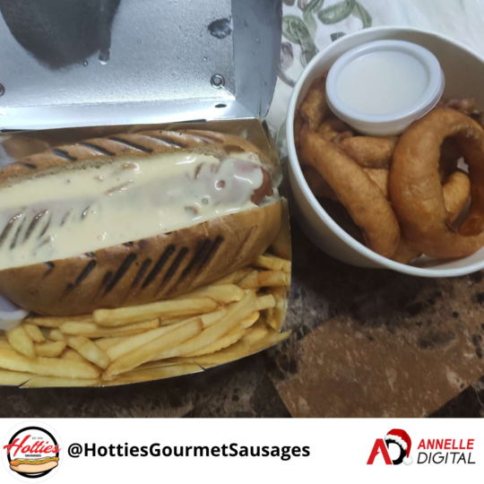  Sausage in a bun with a side of fries and onion rings from Hotties Gourmet Sausages